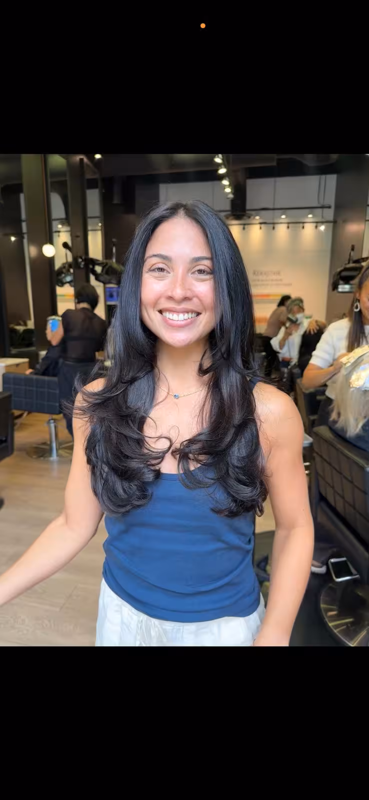 Long black hair with soft layers and bouncy blowout waves - layered haircut Honolulu